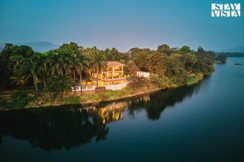 Vasai Villa | StayVista at Maison Vera with Pool, River front view