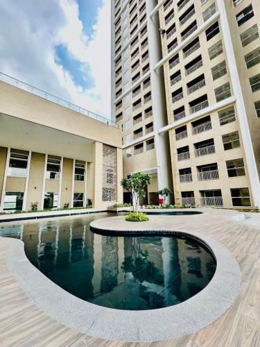 Gandhinagar Apartment | The Grand Palm Retreat with Skyline Suit in GIFT City, 2BHK, Luxurious, Pool, AC, Wifi