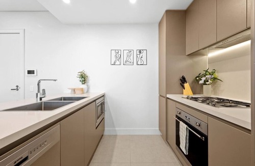 Sydney Olympic Park Apartment | Luxury 2BR Oasis – Panoramic CBD & Park Views