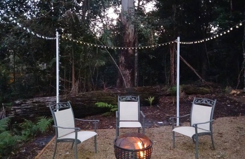 Springbrook House | Luxury Romantic Rainforest Cottage, waterfall area, firepit, fireplace.