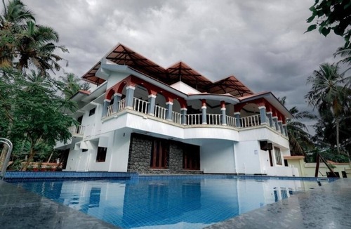 Poovar House | Ocean Queen Palace Poovar – Luxurious Queen Room with Private Balcony