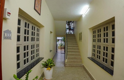 Tirupati Apartment | Pent house room with king-size bed
