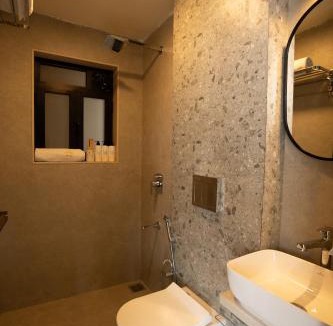 Malavli Villa | SaffronStays Ivory and Orange