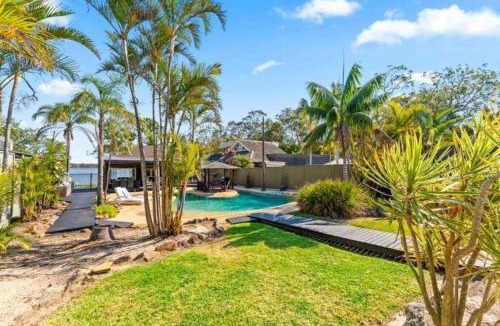 Lake Munmorah Villa | Waterfront Oasis Lakefront Villa with Pool and Sauna