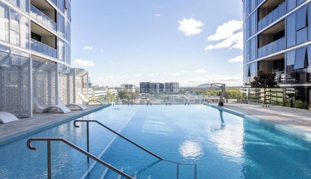 Elegant 3BR Retreat with Pool, Parking and Balcony