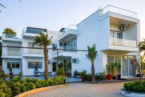 ELIVAAS Signature AdhiVa 5-BHK Farmhouse with Private Pool, Bar & Lush Garden