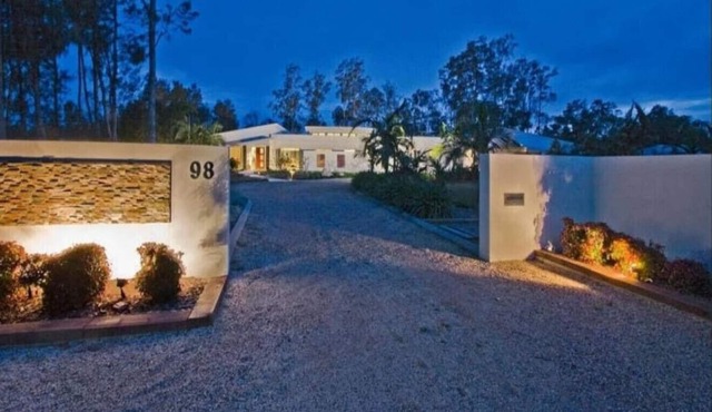 Lake Palm Retreat - shared pool and waterfront