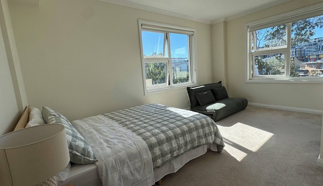 Peaceful modern 2BR riverside stay | free parking