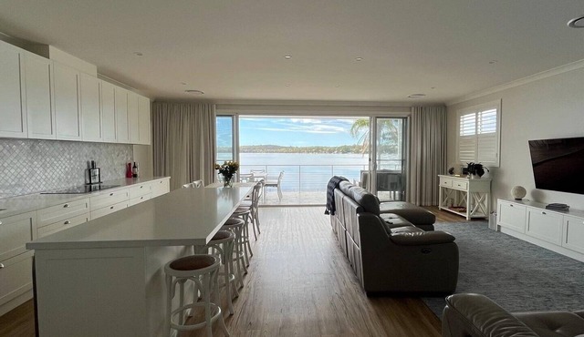 Sparkle by the Lake at this peaceful direct waterfront luxury home