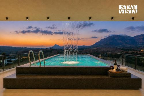 StayVista at Majestic Whispers with Rooftop Pool
