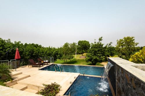 Stone Age Home Fernwood 6-BHK Stone-Clad Estate with Bamboo Cottages, Private Pool, Gazebo & Terrace Garden