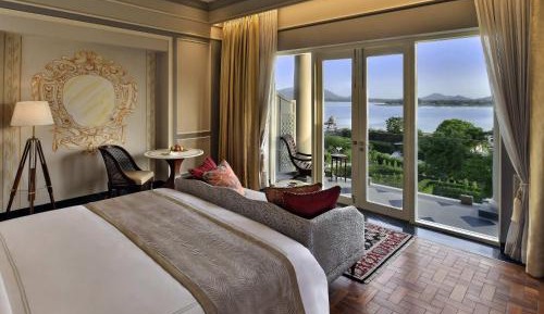Flamingo Signature King Room with Balcony:15% off on Spa | soulful yoga experience| Morning & Evening Aarti | traditional & nature led experiences daily tea,curated walks,bird watching, Prana Garden, Rajasthani folk dance, Pottery, Mehendi, Astrology
