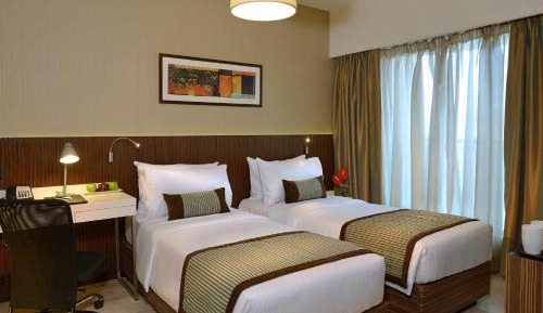 Deluxe Double or Twin Room with 15% off on Food & Beverages Services and 10% off on Two way Airport Transfer and Laundry Services